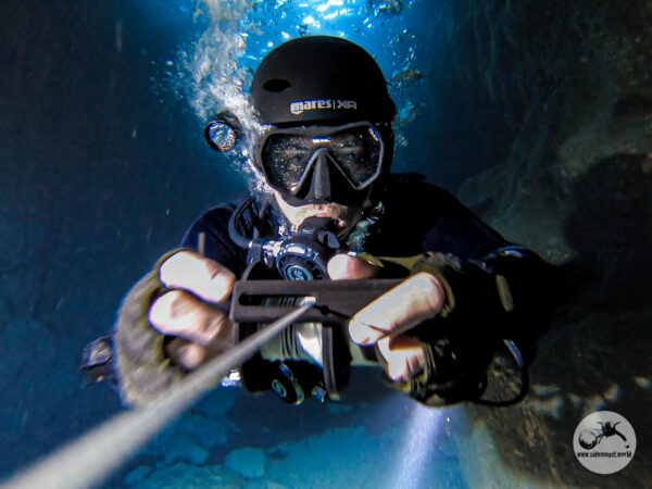 Winding up the line after a cave dive