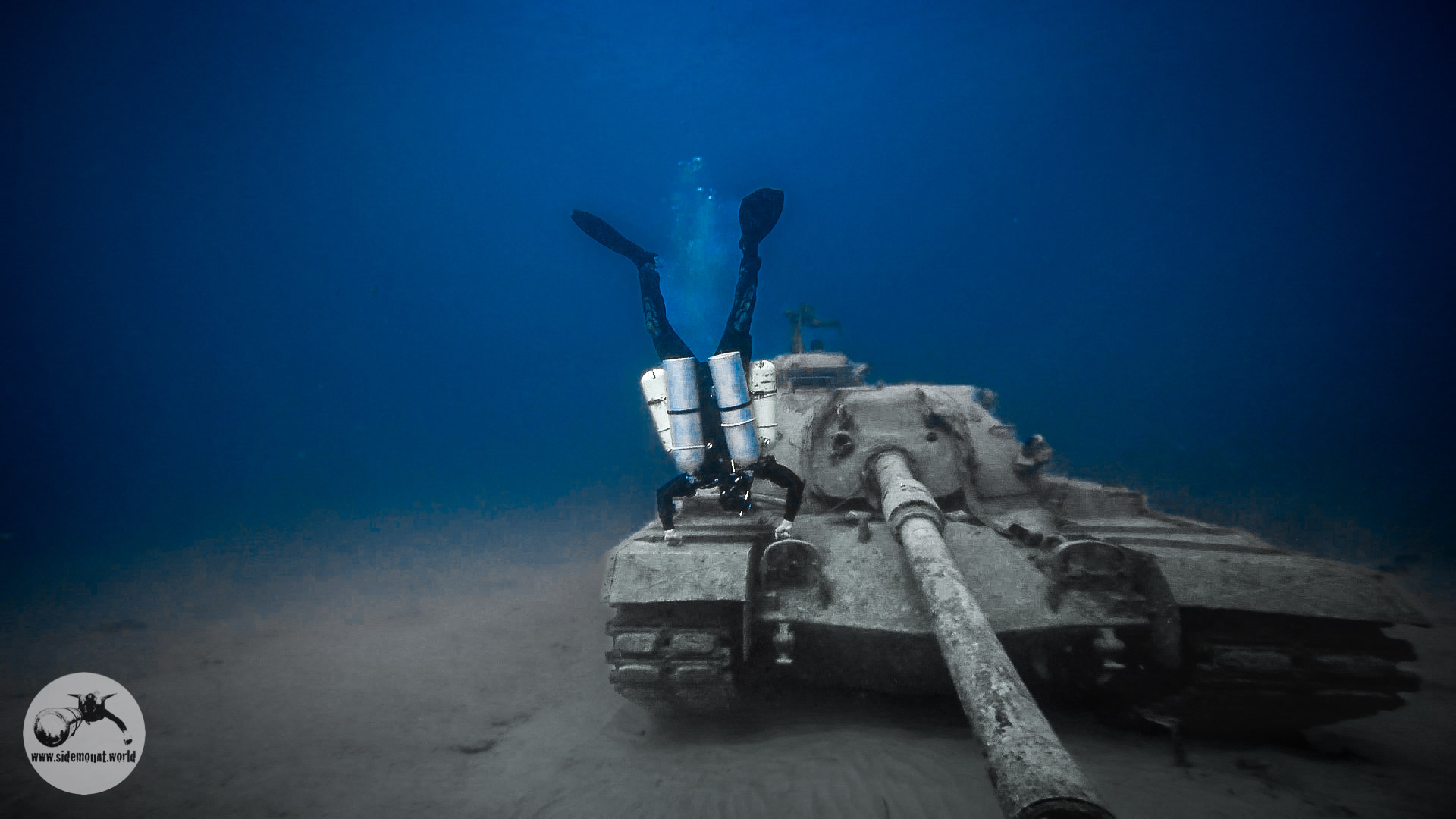 Technical Diver head down above tank